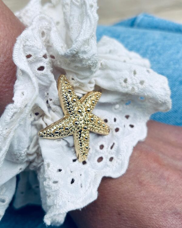 Clip Calypso sur chouchou au poignet Clip Calypso gold